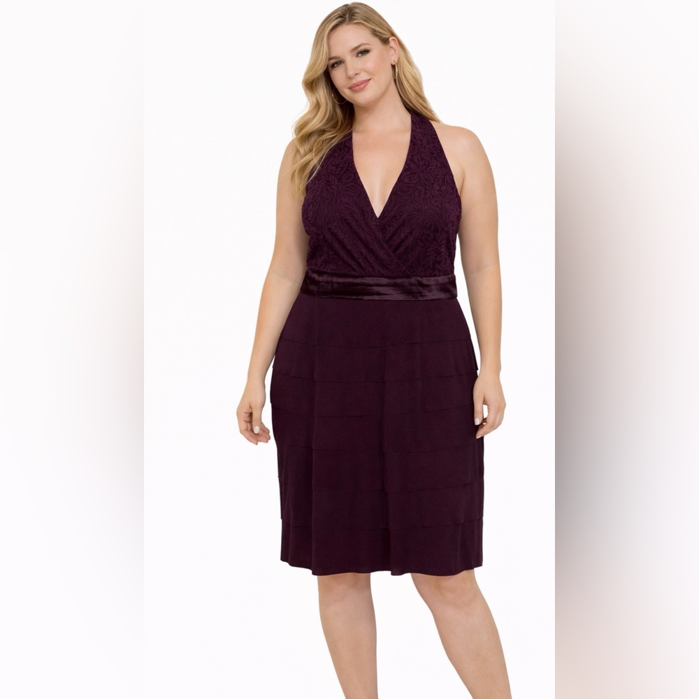 Size 12 this purple elegant dress has a brocade upper and a layered skirt